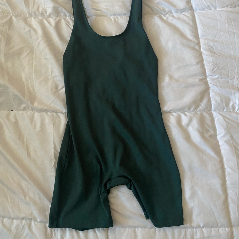 Girlfriend collective unitard in dark green.